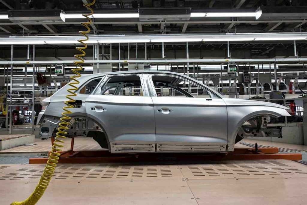 In this photo a car being manufactured