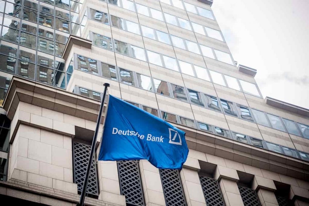 Blue Deutche bank flag is waving on the building