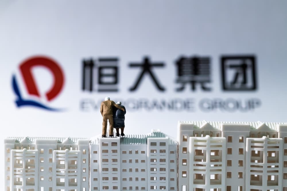 Investors gather outside China Evergrande's HQ shouting “return our money!”